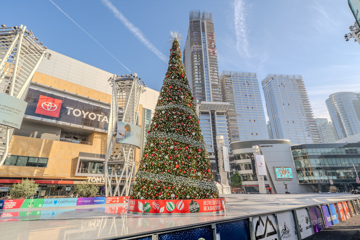 Commercial holiday lighting installation at large Inland Empire shopping center with giant illuminated decorations