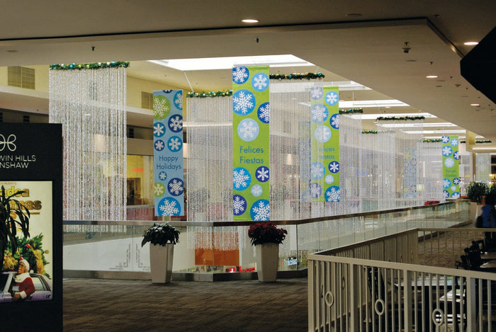 Light curtains and custom teal and light green banners that say 