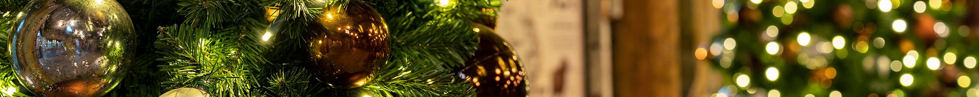 A festive Christmas tree adorned with colorful ornaments, creating a cheerful and inviting atmosphere.