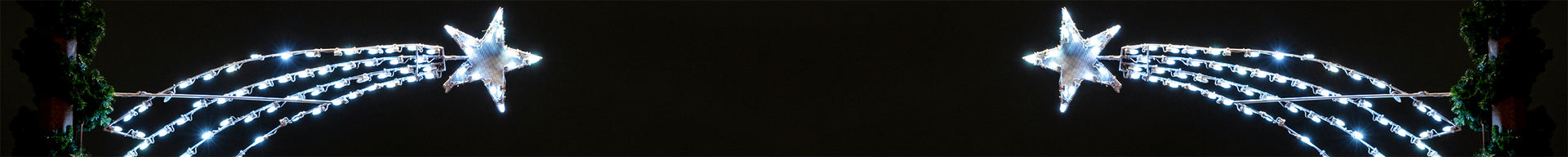 A close-up of two shooting stars, their bright light contrasting with the darkness of space.