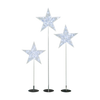Three star-shaped lights on stands against a white background