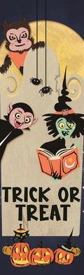 A colorful 30x96 banner for Halloween trick-or-treat featuring a friendly witch, vampire, werewolf, and black cat. Text on the banner reads 