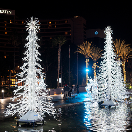 A decorative crystal branch tree, formed entirely from a network of cool white lights on a sturdy metal frame. This versatile piece offers a shimmering wintery effect.