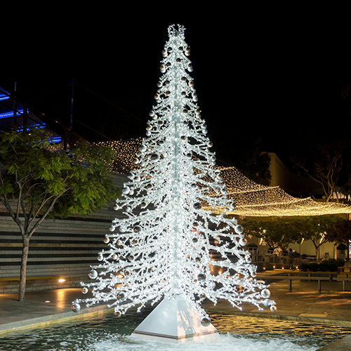 A decorative crystal branch tree, formed entirely from a network of cool white lights on a sturdy metal frame. This versatile piece offers a shimmering wintery effect.