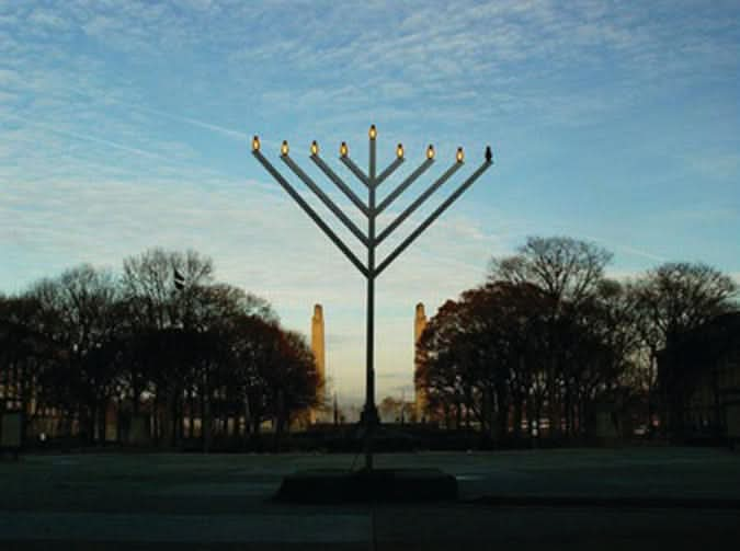 Dekra-Lite Aluminum Brushed Menorah at Night