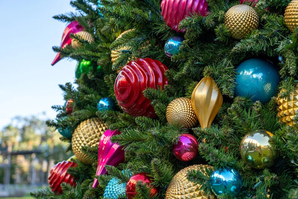 Colorful ornaments and lush greenery on a commercial Christmas display